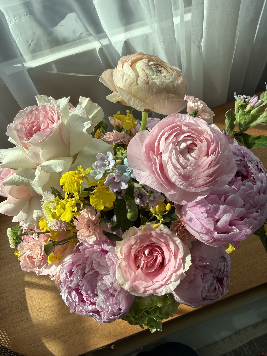 Pastel bouquet with roses and ranunculus